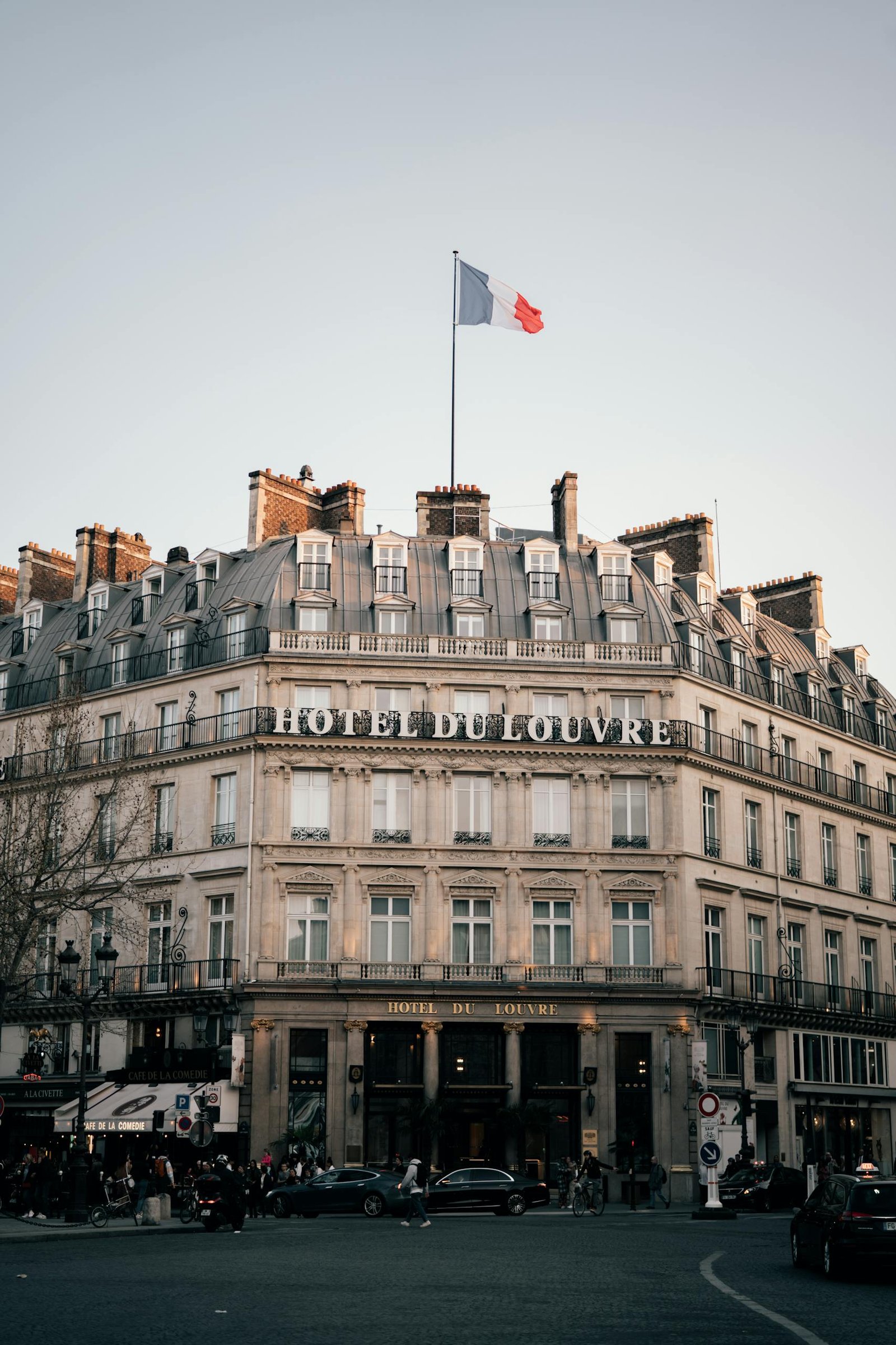 capture of the historic hotel du louvre in paris showcasing classic architecture at dusk. 20170141 scaled