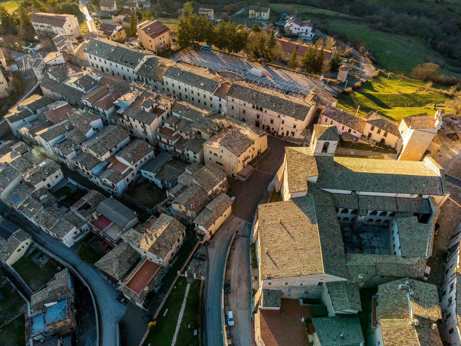 drone shot capturing a picturesque old european town from above with warm tones of sunset. 10804681 scaled